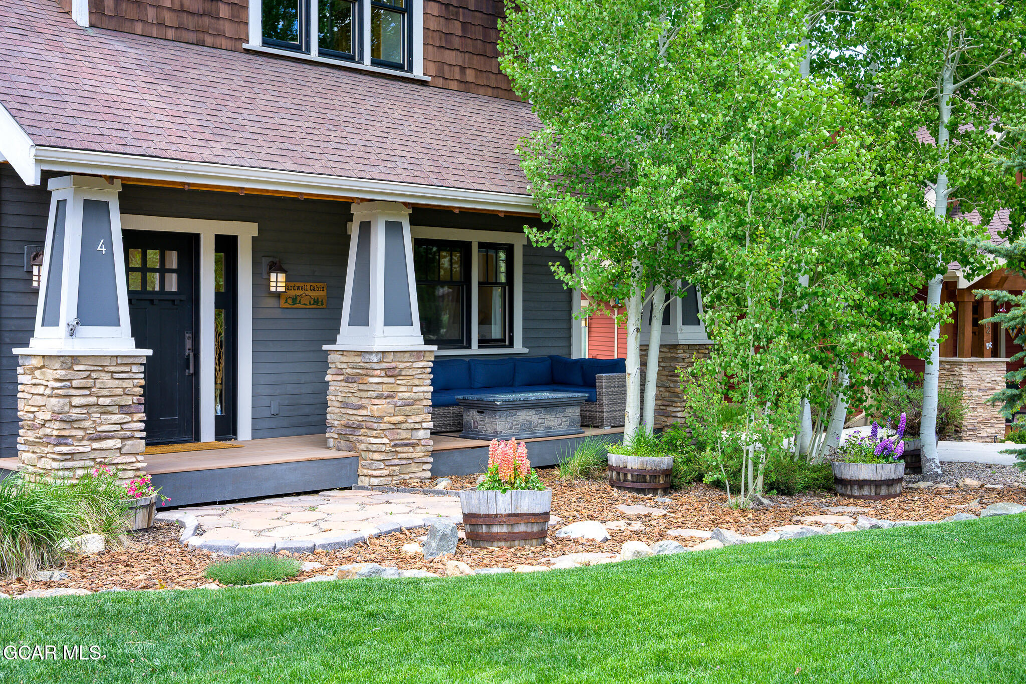 4 Rifle Shot Trail Fraser, CO 80442 - Photo 47 of 47 a view of a house with a yard and table and chairs under an umbrella