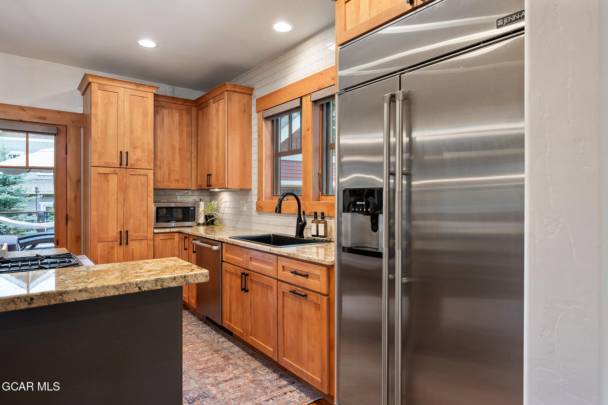4 Rifle Shot Trail Fraser, CO 80442 - Photo 6 of 47 a kitchen with stainless steel appliances granite countertop a refrigerator a sink and white cabinets