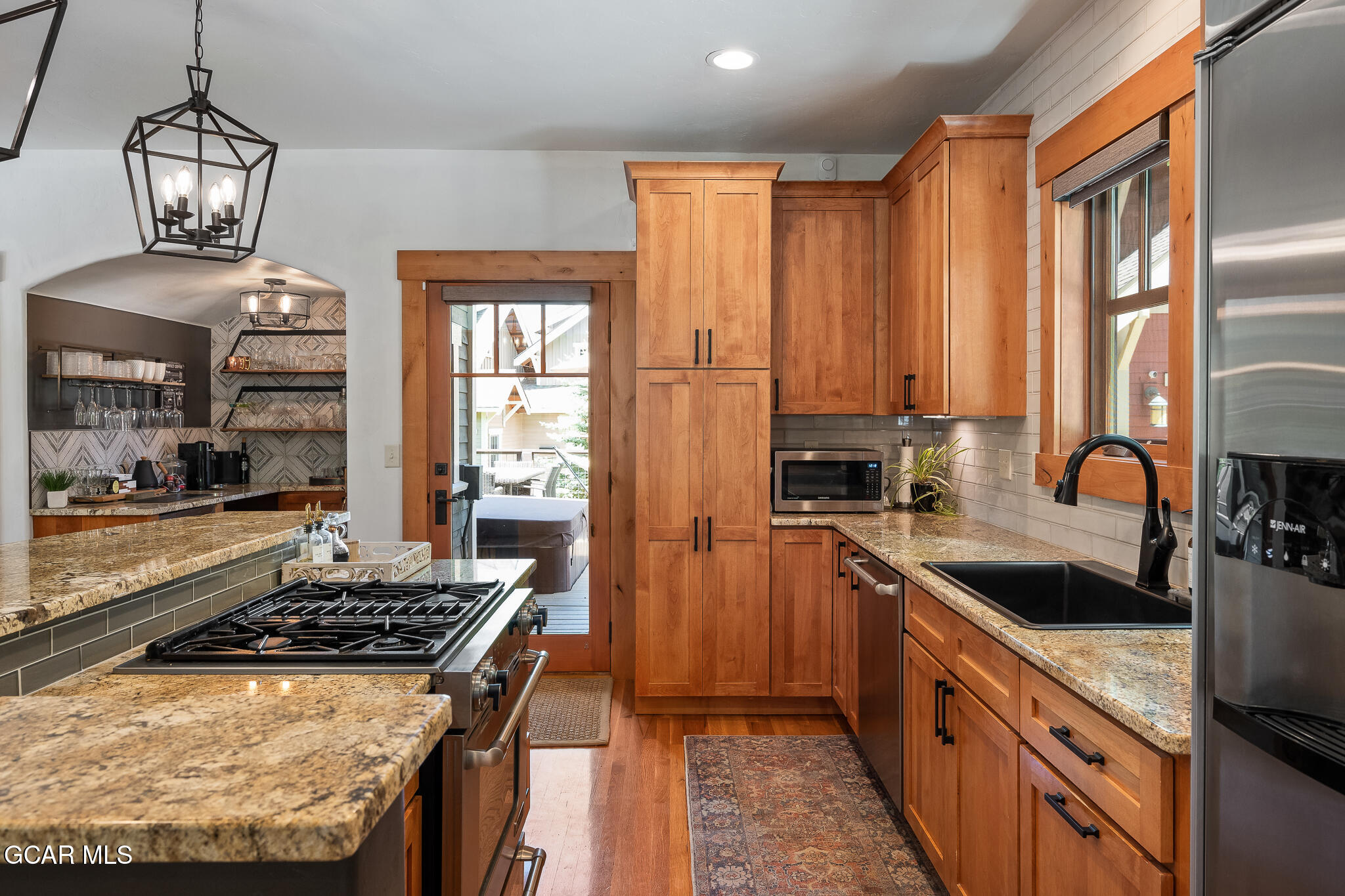 4 Rifle Shot Trail Fraser, CO 80442 - Photo 7 of 47 a kitchen with kitchen island granite countertop a sink stainless steel appliances and cabinets