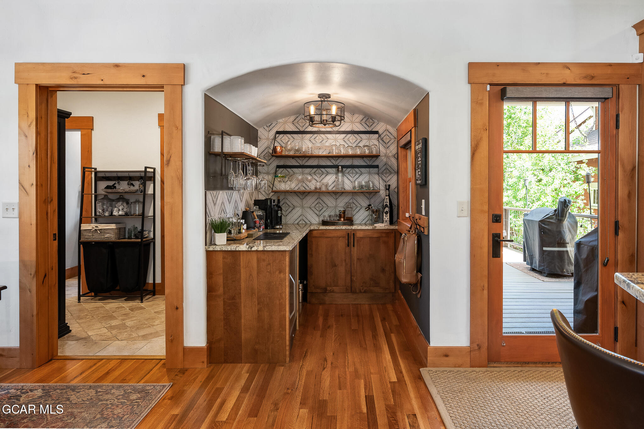 4 Rifle Shot Trail Fraser, CO 80442 - Photo 9 of 47 a view of a hallway with wooden floor windows and a livingroom