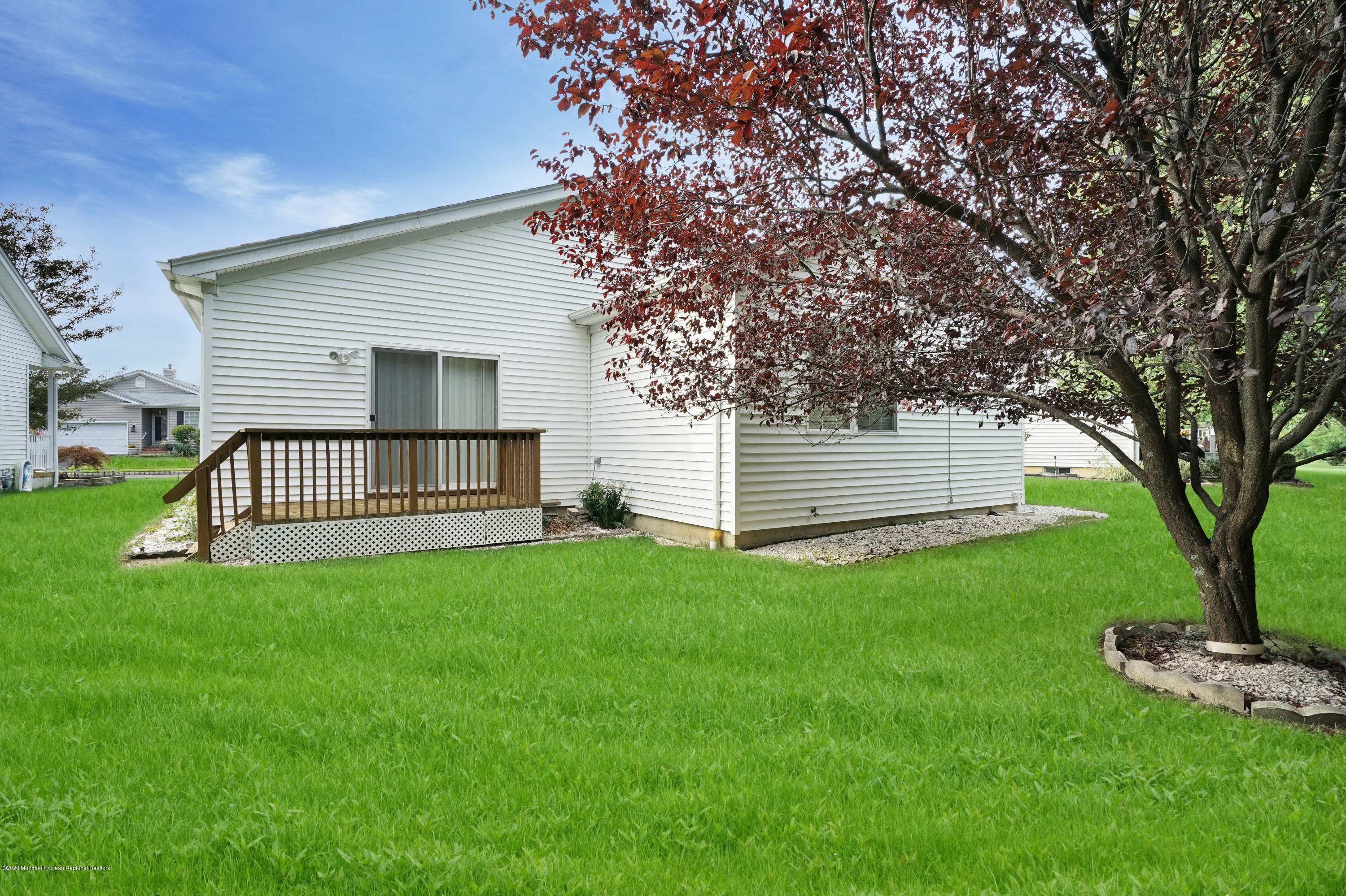 187 Wordsworth Road Brick, NJ 08724 - Photo 38 of 41 a view of a backyard with a large tree