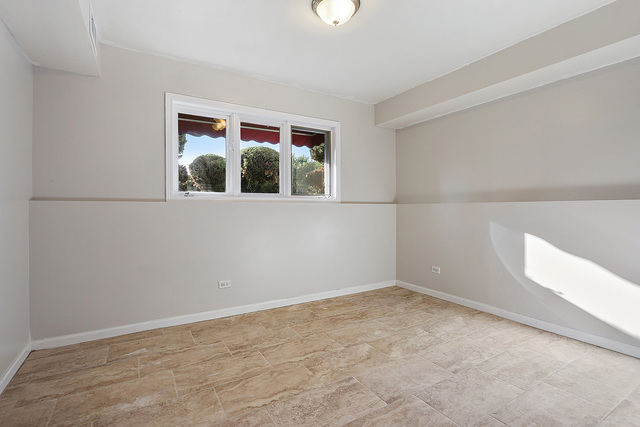 5338 State Road Burbank, IL 60459 - Photo 15 of 21 a view of an empty room with a window