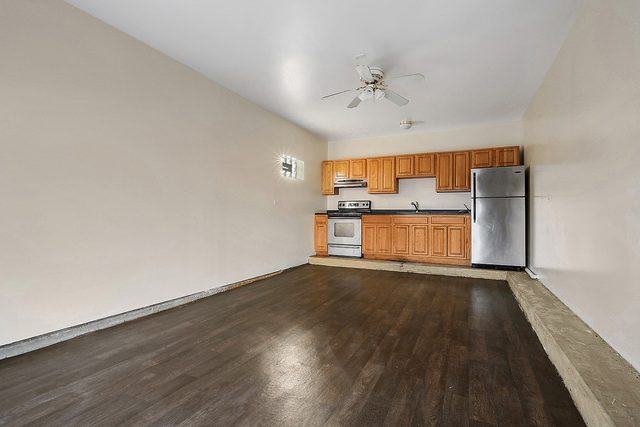5338 State Road Burbank, IL 60459 - Photo 17 of 21 wooden floor in an empty room with a window