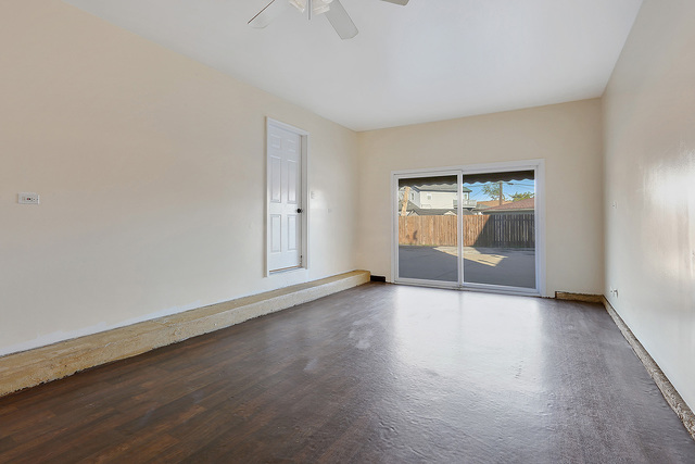 5338 State Road Burbank, IL 60459 - Photo 18 of 21 an empty room with wooden floor and cabinet