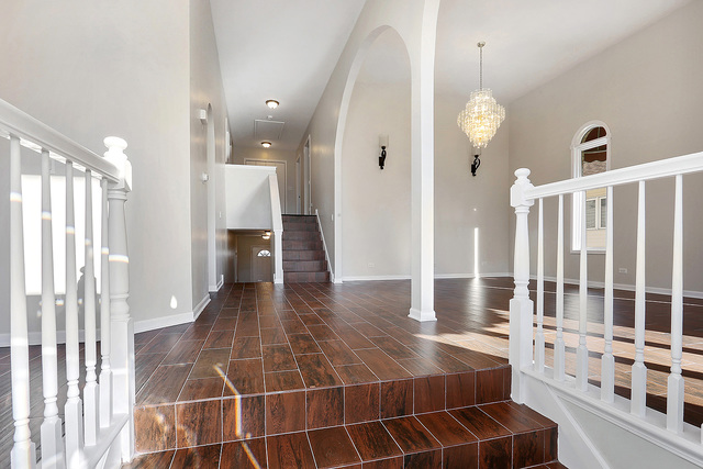 5338 State Road Burbank, IL 60459 - Photo 20 of 21 a view of a hallway with wooden floor and staircase
