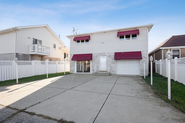 5338 State Road Burbank, IL 60459 - Photo 21 of 21 a view of backyard with refrigerator and wooden floor