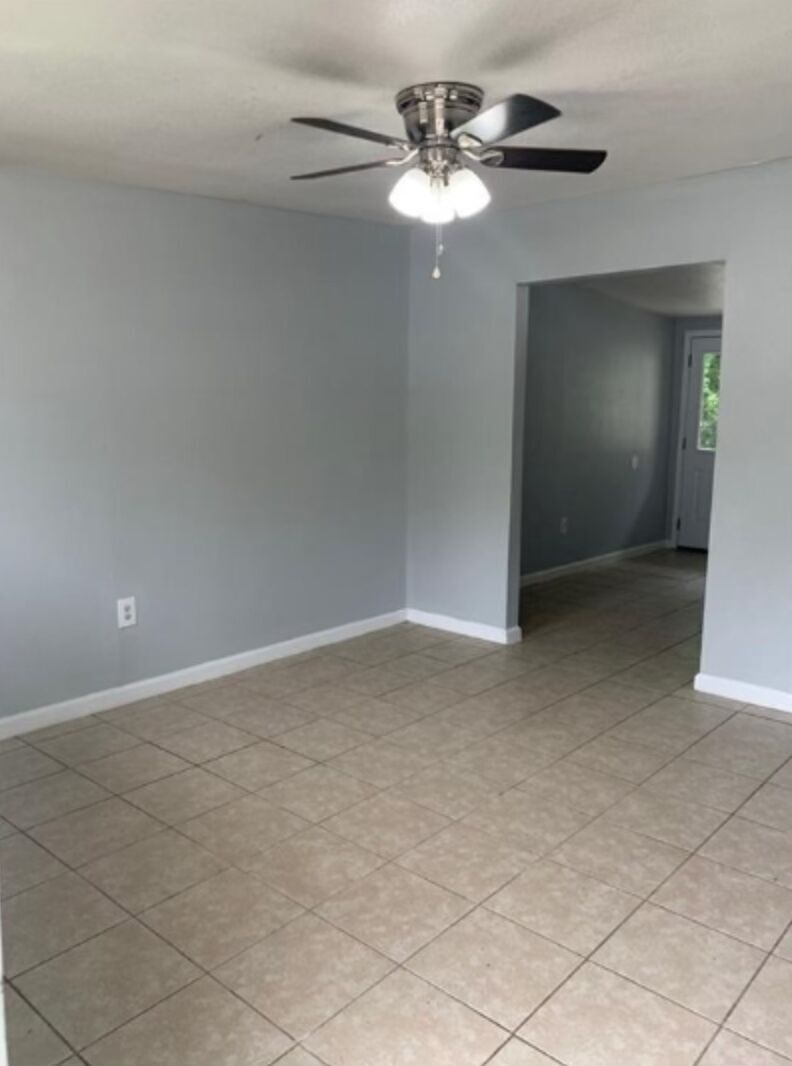 1013 Hackberry Street, Unit B San Marcos, TX 78666 - Photo 3 of 9 a view of an empty room with a chandelier fan