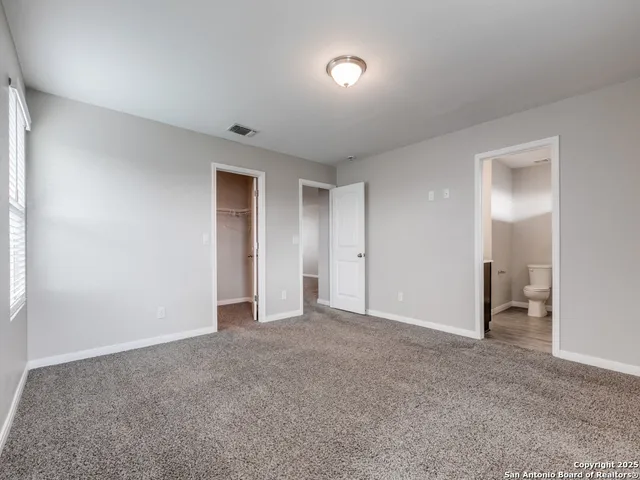 a bathroom with a toilet and a sink