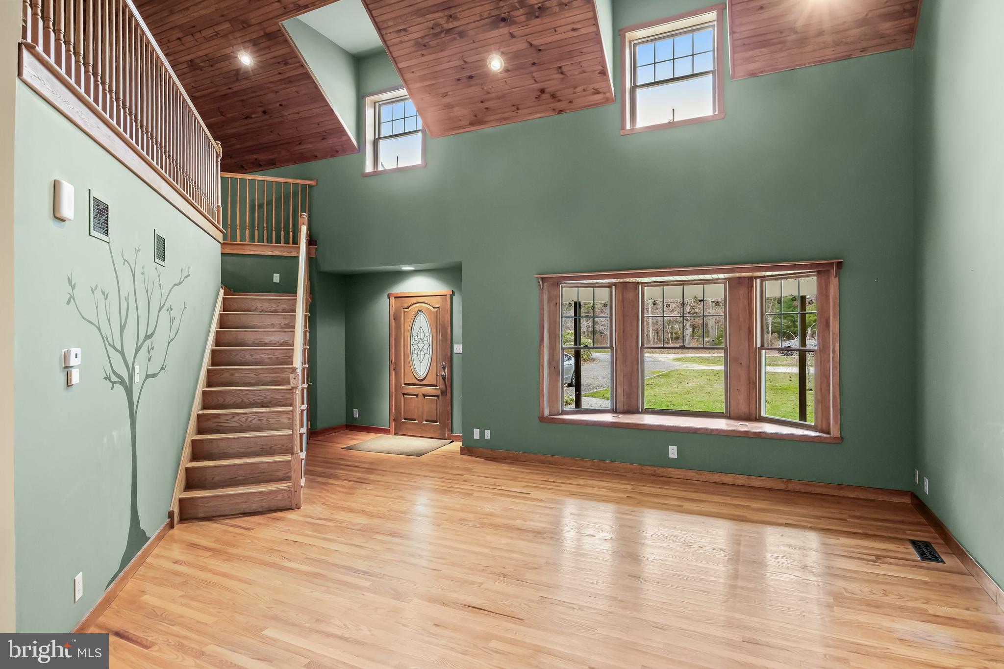 3259 Union Road Vineland, NJ 08361 - Photo 25 of 81 a view of an empty room with wooden floor and stairs