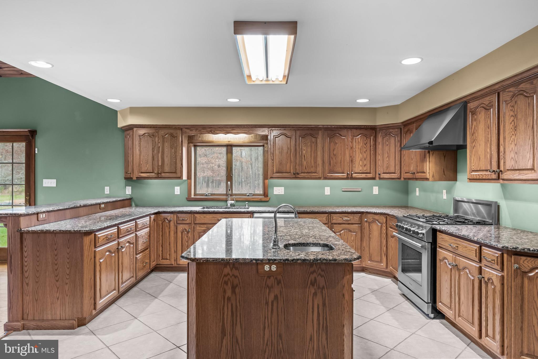 3259 Union Road Vineland, NJ 08361 - Photo 32 of 81 a kitchen with stainless steel appliances granite countertop a sink counter space cabinets and a large window