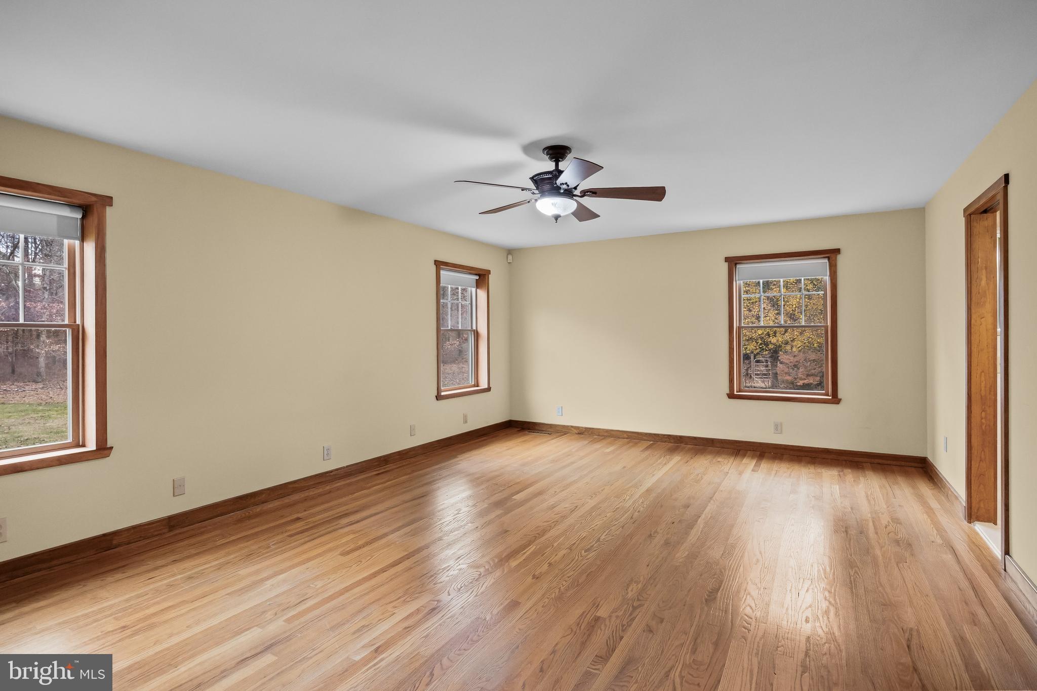 3259 Union Road Vineland, NJ 08361 - Photo 38 of 81 a view of an empty room with a window and wooden floor