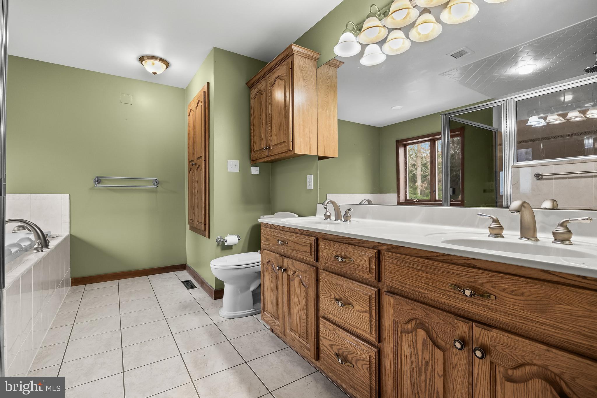 3259 Union Road Vineland, NJ 08361 - Photo 41 of 81 a spacious bathroom with a double vanity sink mirror and toilet