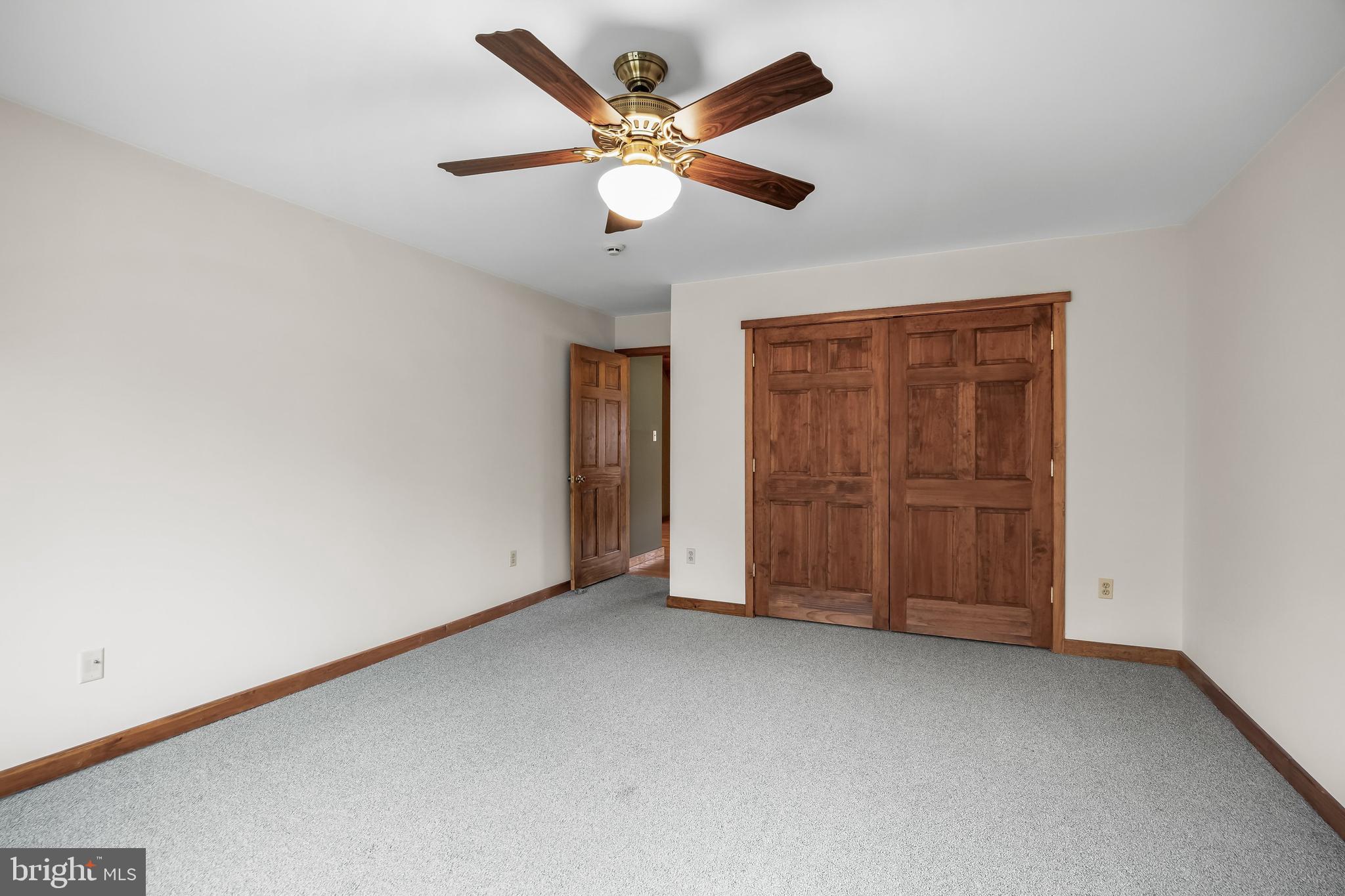 3259 Union Road Vineland, NJ 08361 - Photo 51 of 81 an empty room with closet and ceiling fan