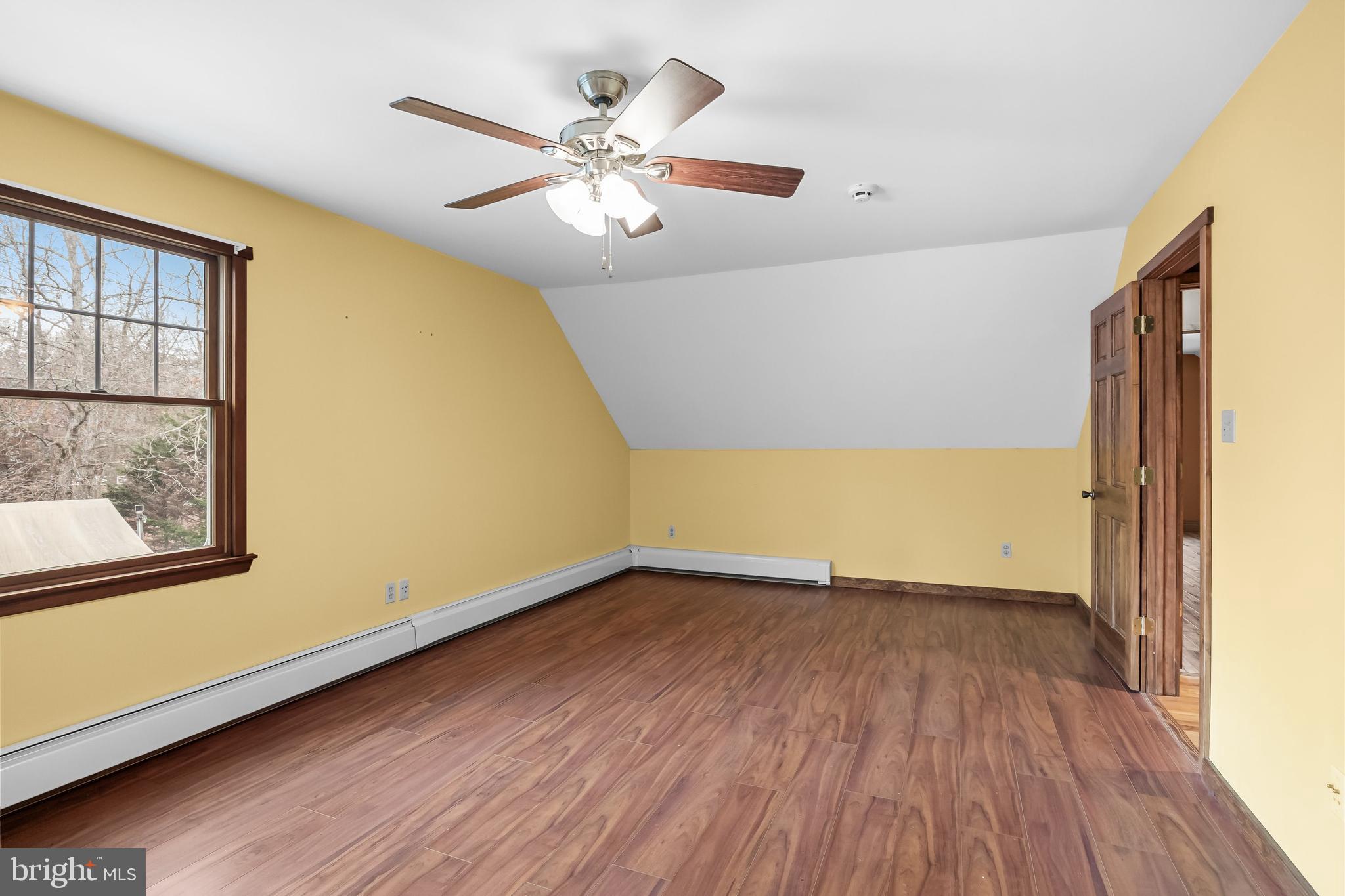 3259 Union Road Vineland, NJ 08361 - Photo 54 of 81 a view of an empty room with wooden floor and a window