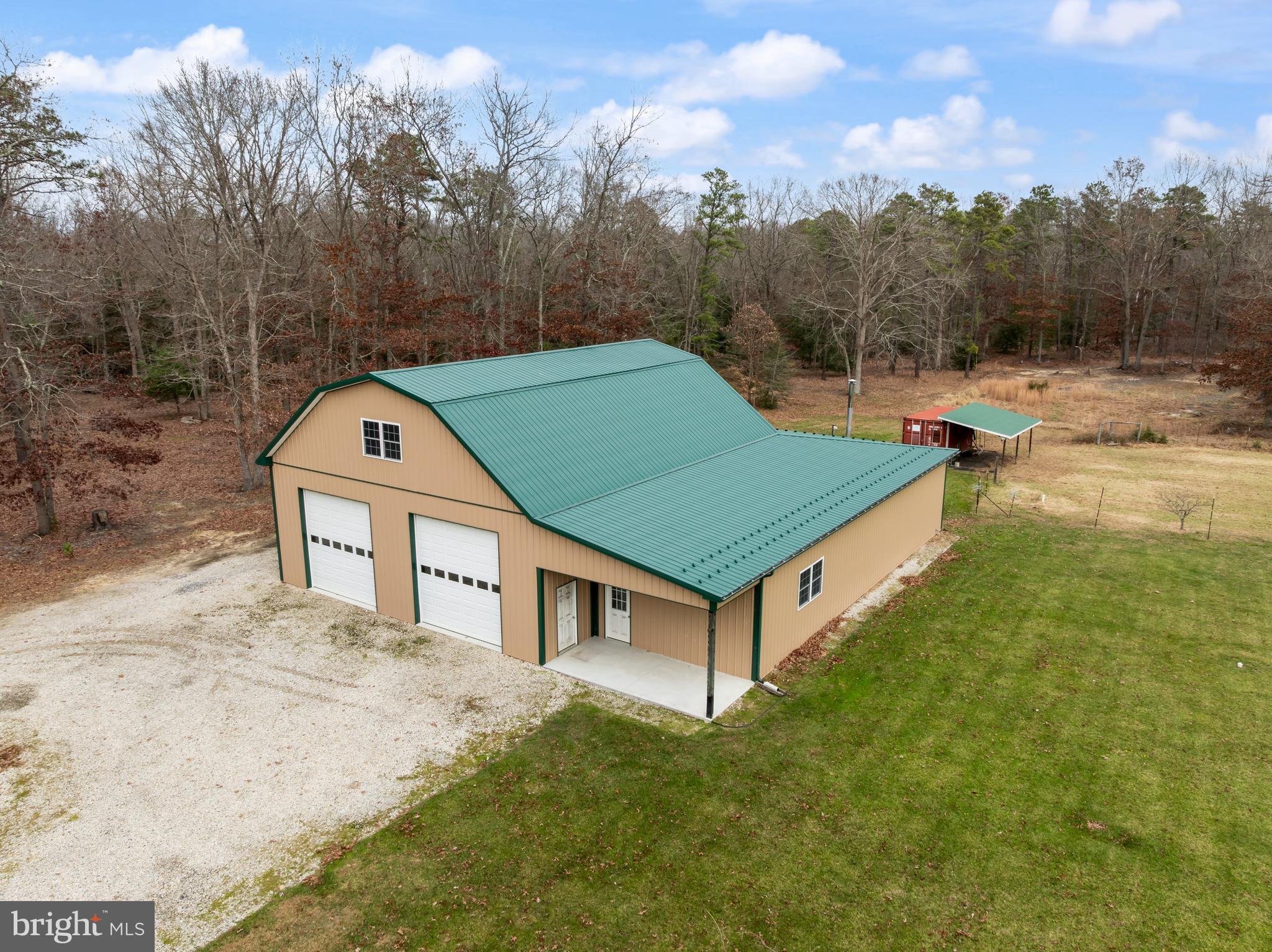 3259 Union Road Vineland, NJ 08361 - Photo 9 of 81 a view of a white house in the middle of a yard