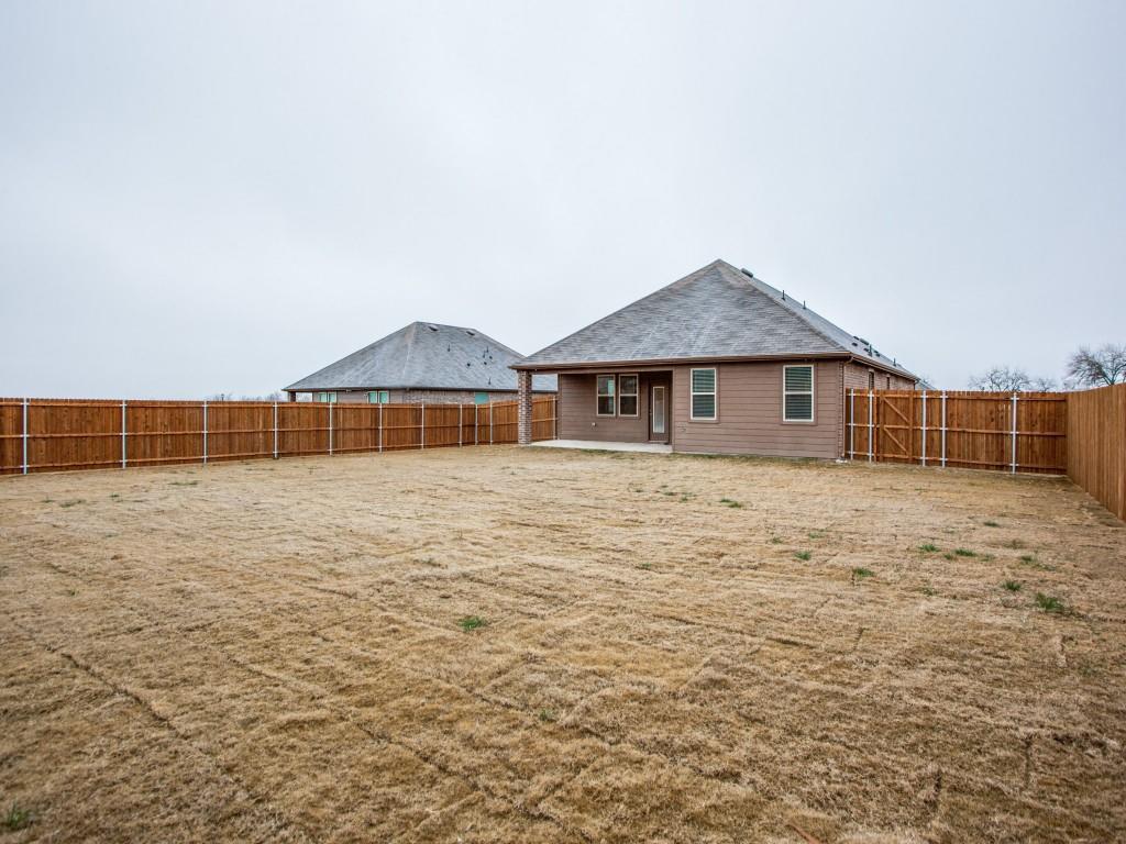 123 Lakeview Circle Pilot Point, TX 76258 - Photo 37 of 39 a front view of a house with a yard
