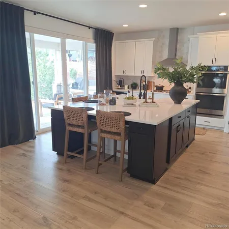 a living room with a large window and a table