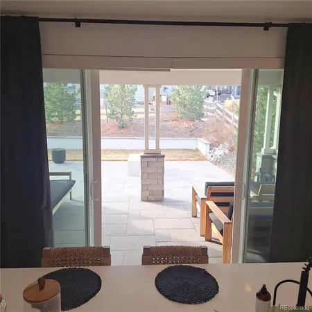 a view of a livingroom with furniture window and wooden floor