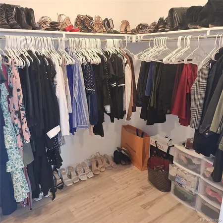 a bathroom with a double vanity sink a mirror and a shower