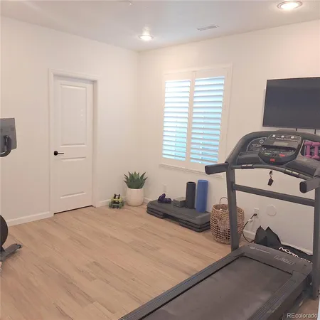 a view of an empty room and wooden floor