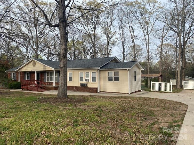181 Spring Garden Avenue Kannapolis, NC 28081 - Photo 1 of 30 a front view of a house with yard