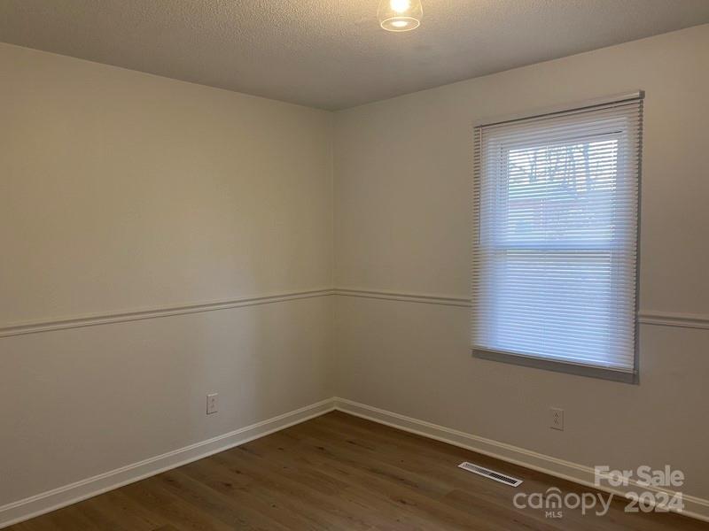 181 Spring Garden Avenue Kannapolis, NC 28081 - Photo 11 of 30 an empty room with a window