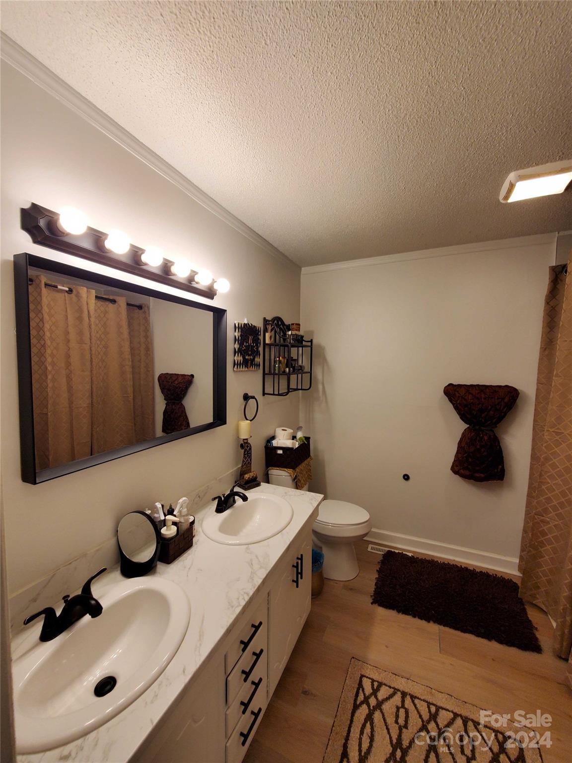 181 Spring Garden Avenue Kannapolis, NC 28081 - Photo 14 of 30 a bathroom with a double vanity sink mirror and toilet