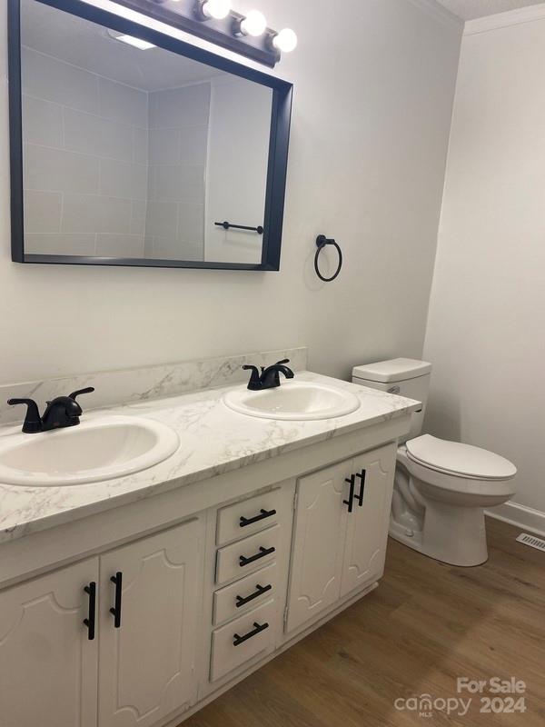 181 Spring Garden Avenue Kannapolis, NC 28081 - Photo 15 of 30 a bathroom with a sink a toilet and mirror