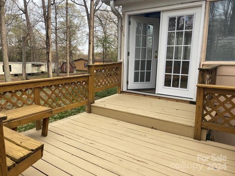 181 Spring Garden Avenue Kannapolis, NC 28081 - Photo 25 of 30 a view of a balcony with wooden floor and fence