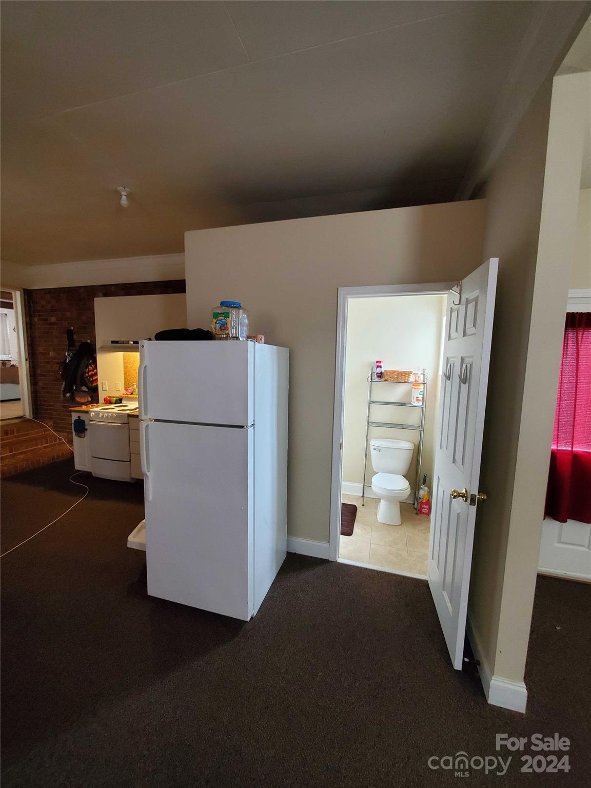 181 Spring Garden Avenue Kannapolis, NC 28081 - Photo 29 of 30 a view of a storage & utility room with refrigerator