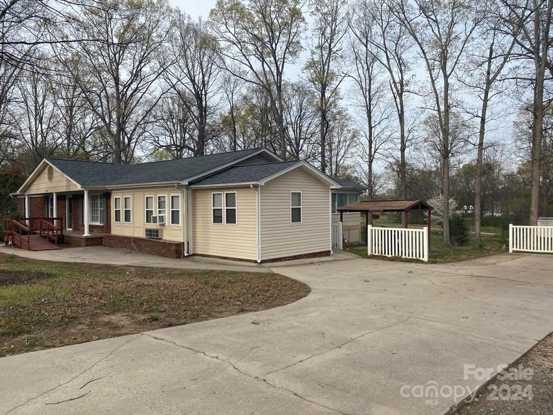 181 Spring Garden Avenue Kannapolis, NC 28081 - Photo 3 of 30 a view of house with outdoor seating and yard