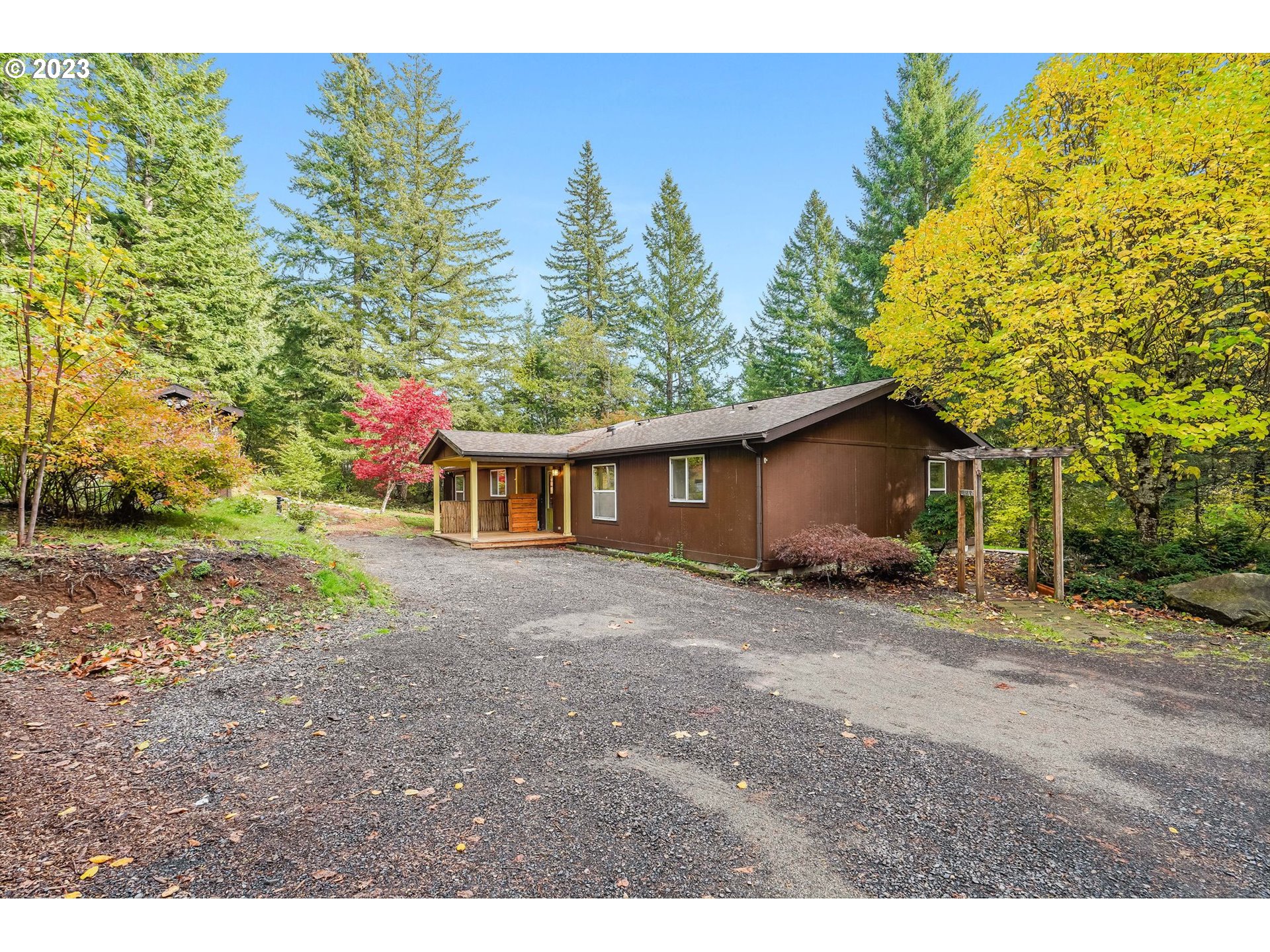 2242 East Loop Road Stevenson, WA 98648 - Photo 1 of 48 a view of a house with a yard and tree s
