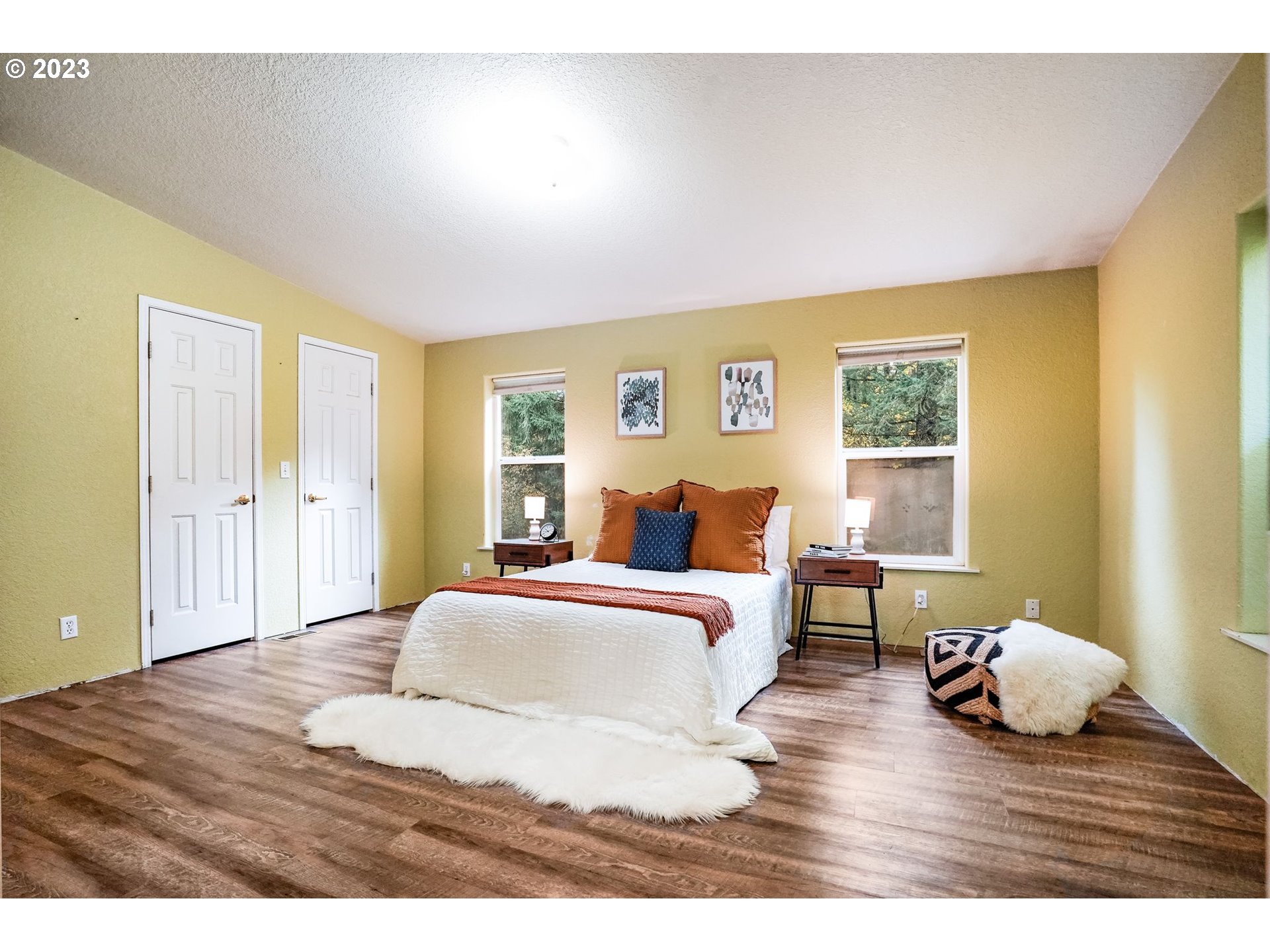 2242 East Loop Road Stevenson, WA 98648 - Photo 22 of 48 a bedroom with a bed and wooden floor