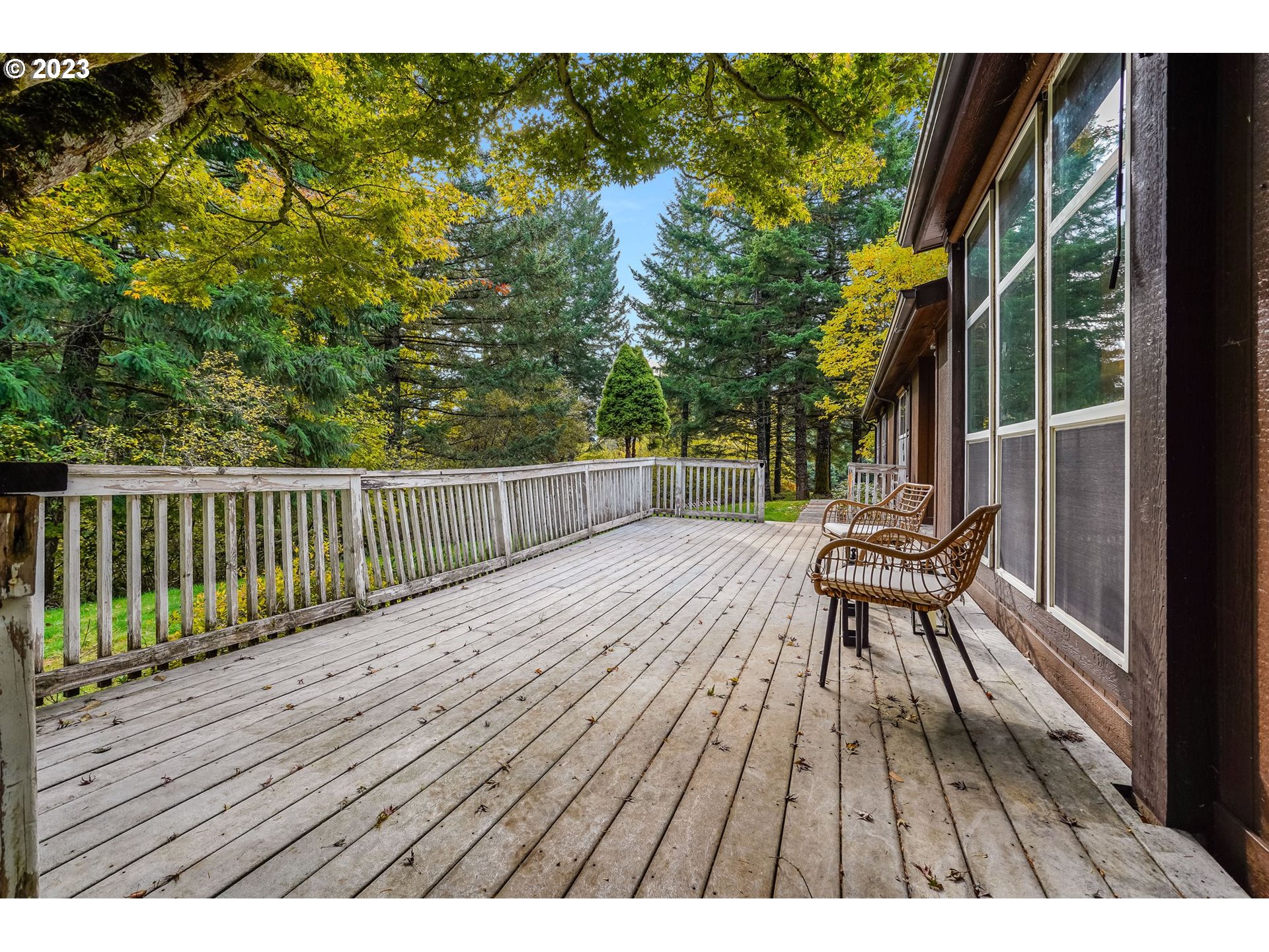 2242 East Loop Road Stevenson, WA 98648 - Photo 37 of 48 a view of backyard with a deck and wooden floor