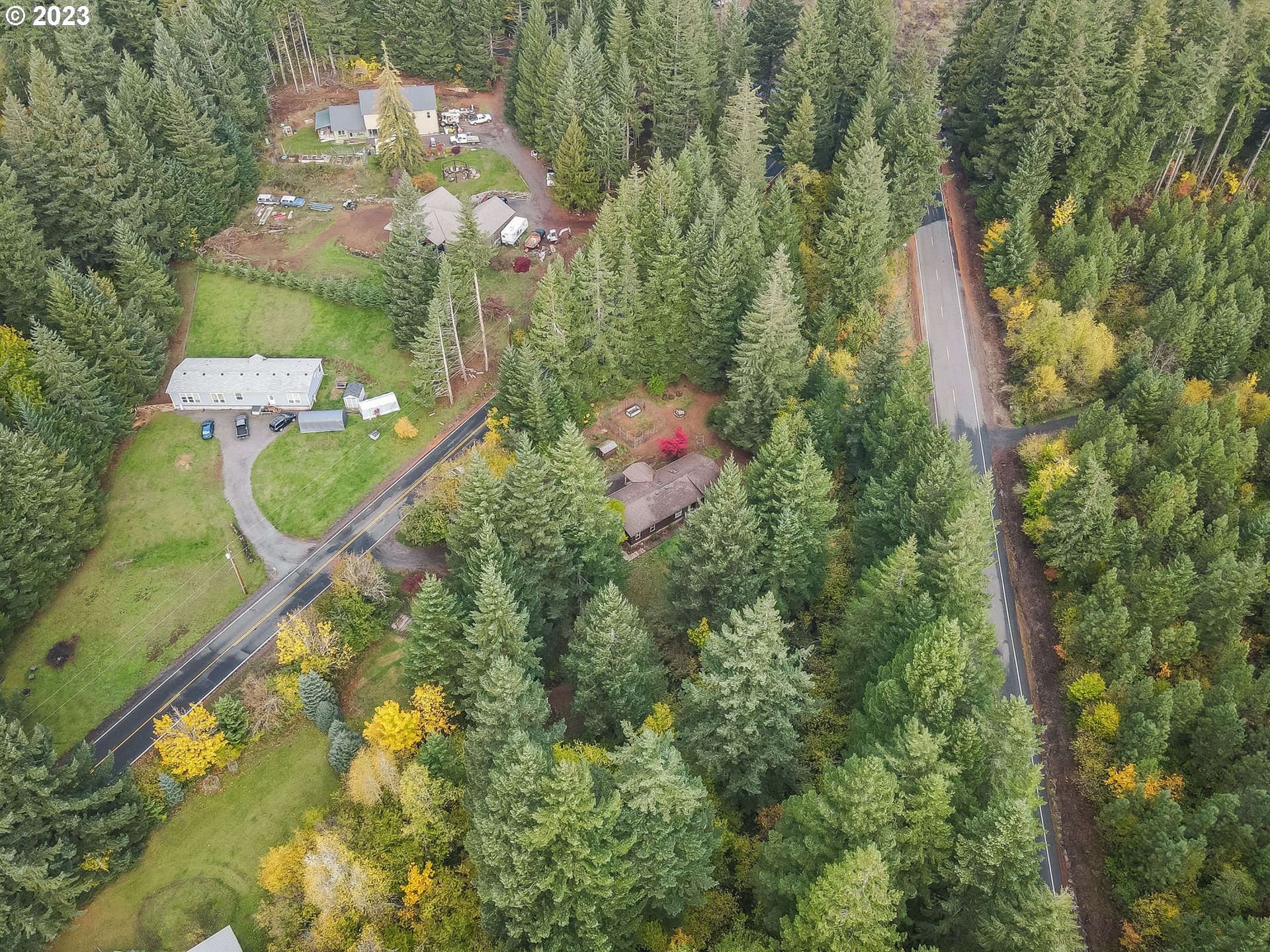 2242 East Loop Road Stevenson, WA 98648 - Photo 43 of 48 an aerial view of a house with a yard and trees