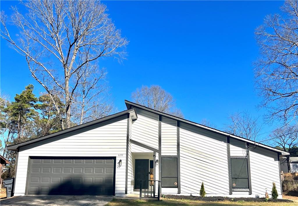 8290 Webb Road Riverdale, GA 30274 - Photo 1 of 1 a view of a house with a large tree