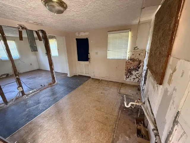 a view of an entryway with wooden floor