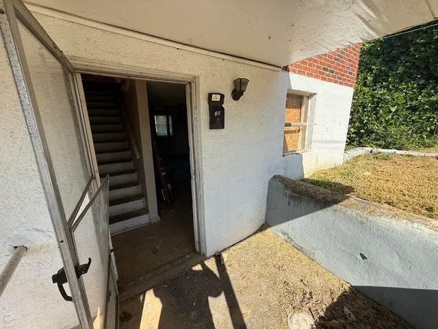 a view of a closet and a sink