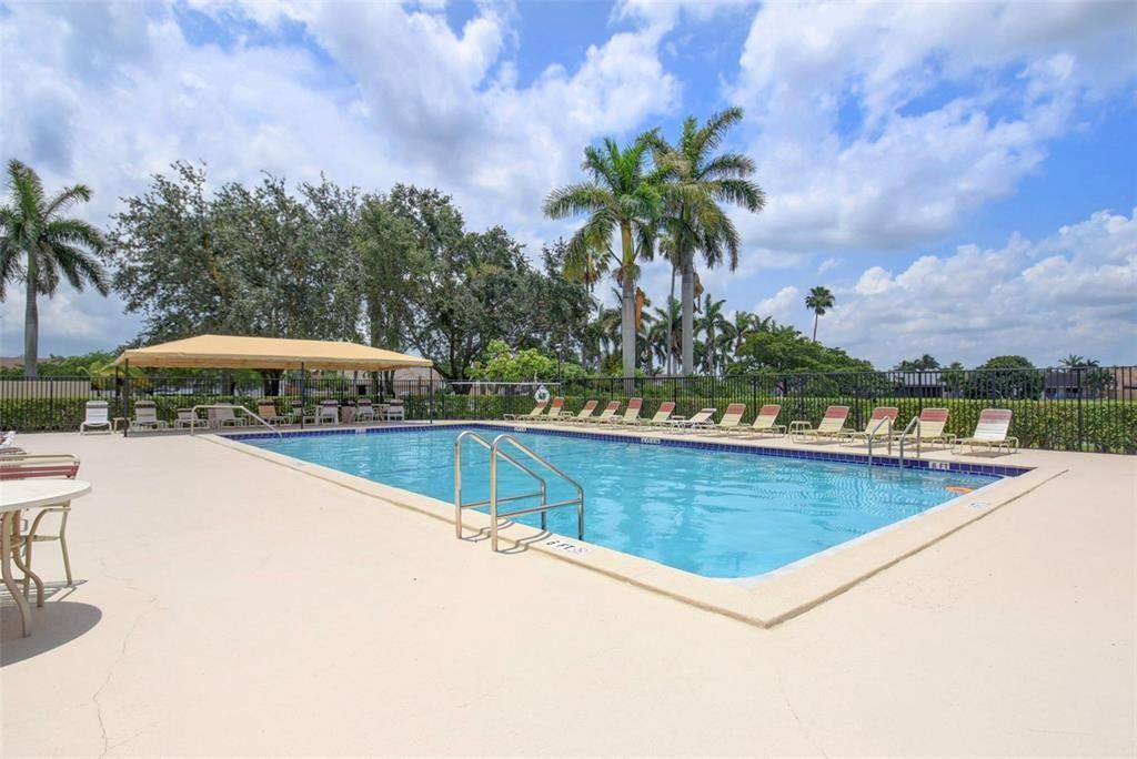 9398 Laurel Green Drive Boynton Beach, FL 33437 - Photo 12 of 19 a view of a swimming pool from a terrace