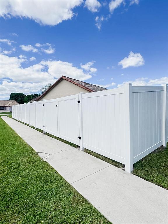 9398 Laurel Green Drive Boynton Beach, FL 33437 - Photo 17 of 19 a view of a garage