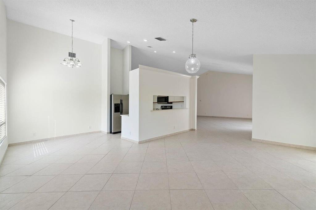 9398 Laurel Green Drive Boynton Beach, FL 33437 - Photo 6 of 19 a view of a kitchen with a sink and cabinet area