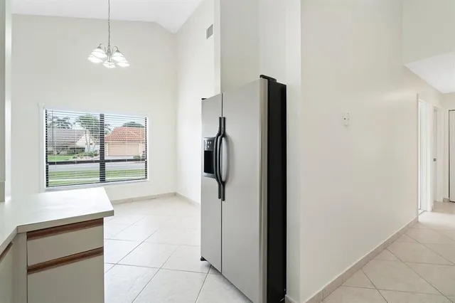 a kitchen with stainless steel appliances a stove a microwave and a refrigerator