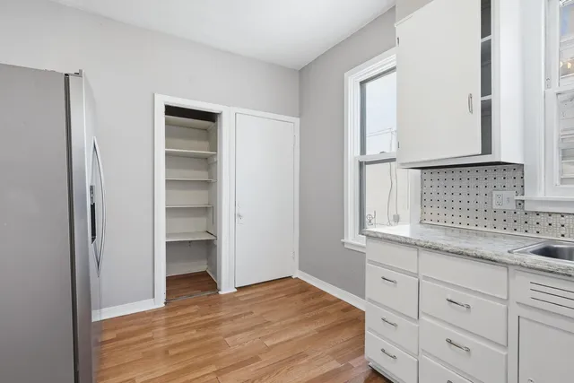 a view of cabinets and window