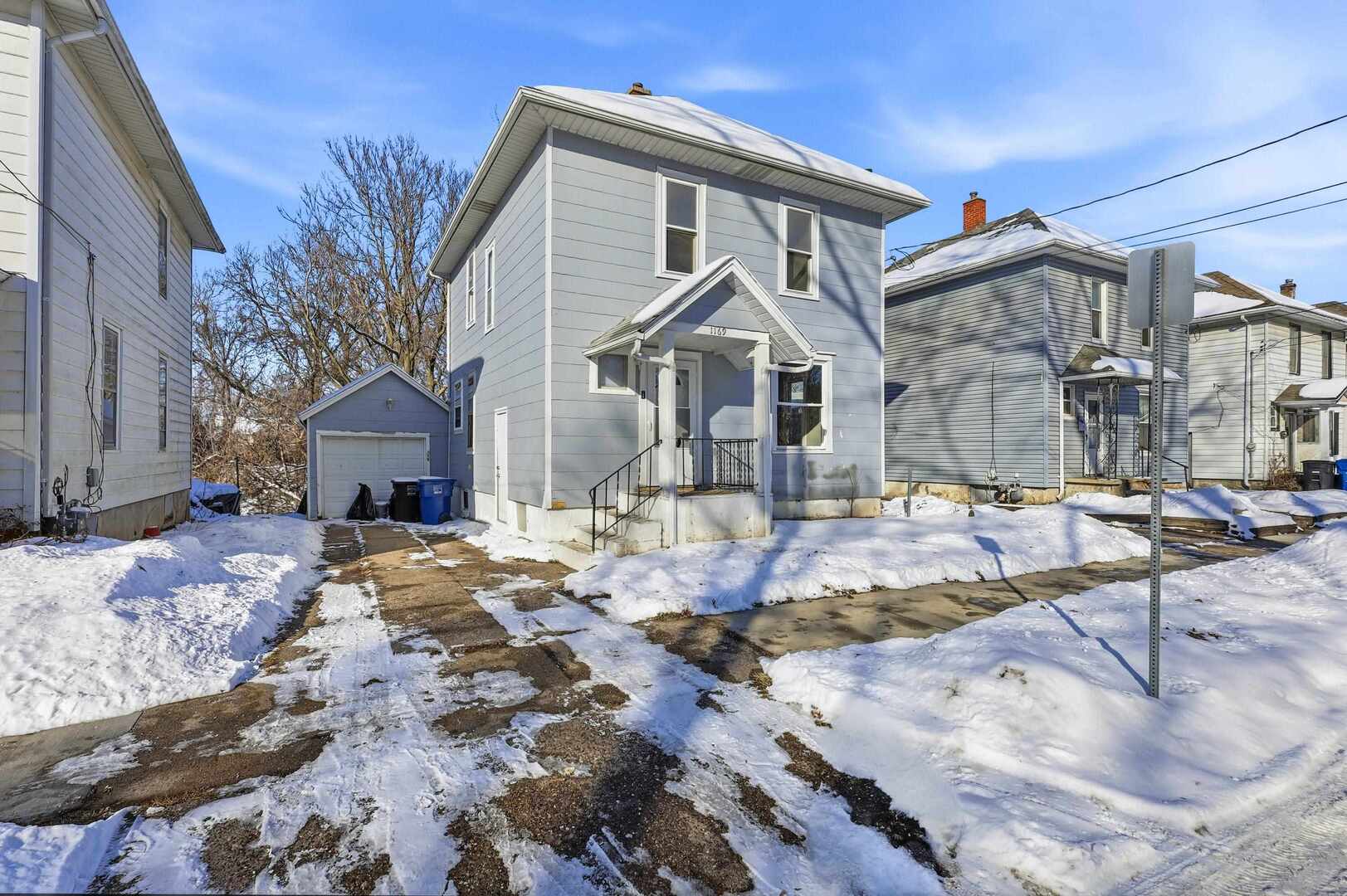 1169 23rd Street Moline, IL 61265 - Photo 2 of 20 a front view of a house with a yard