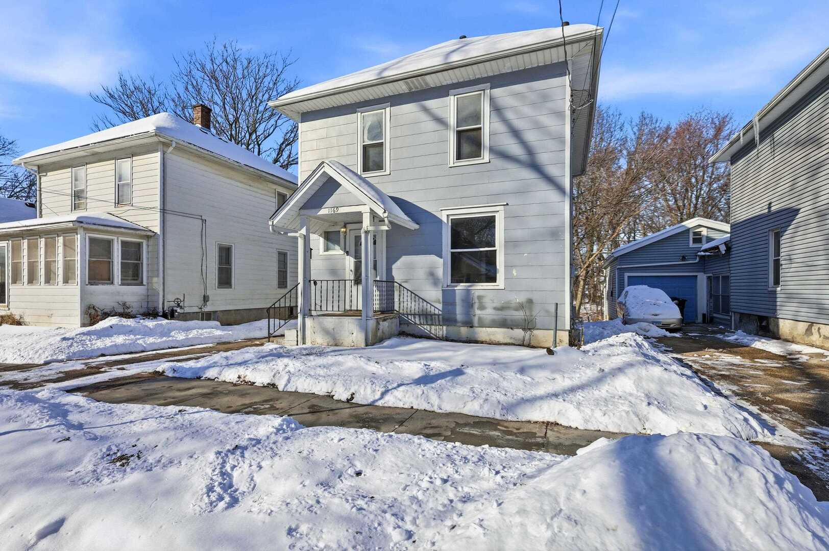 1169 23rd Street Moline, IL 61265 - Photo 3 of 20 a view of a house with snow on the side of the road