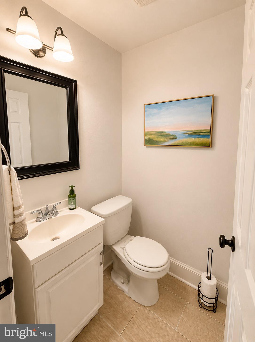 22 Balligomingo Road Conshohocken, PA 19428 - Photo 9 of 35 a bathroom with a toilet sink and mirror