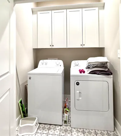 a roof deck with a table and chairs