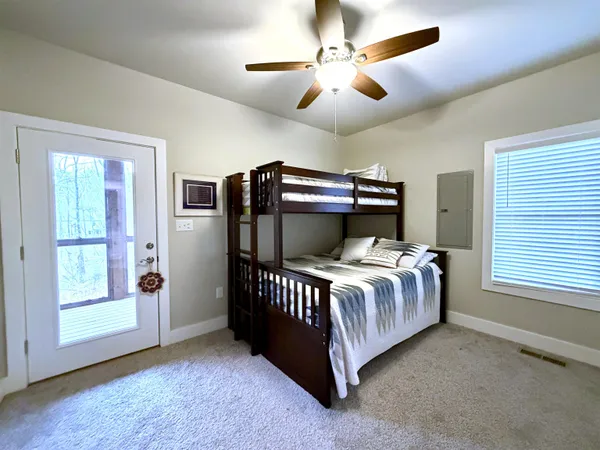 a bathroom with a sink mirror and vanity
