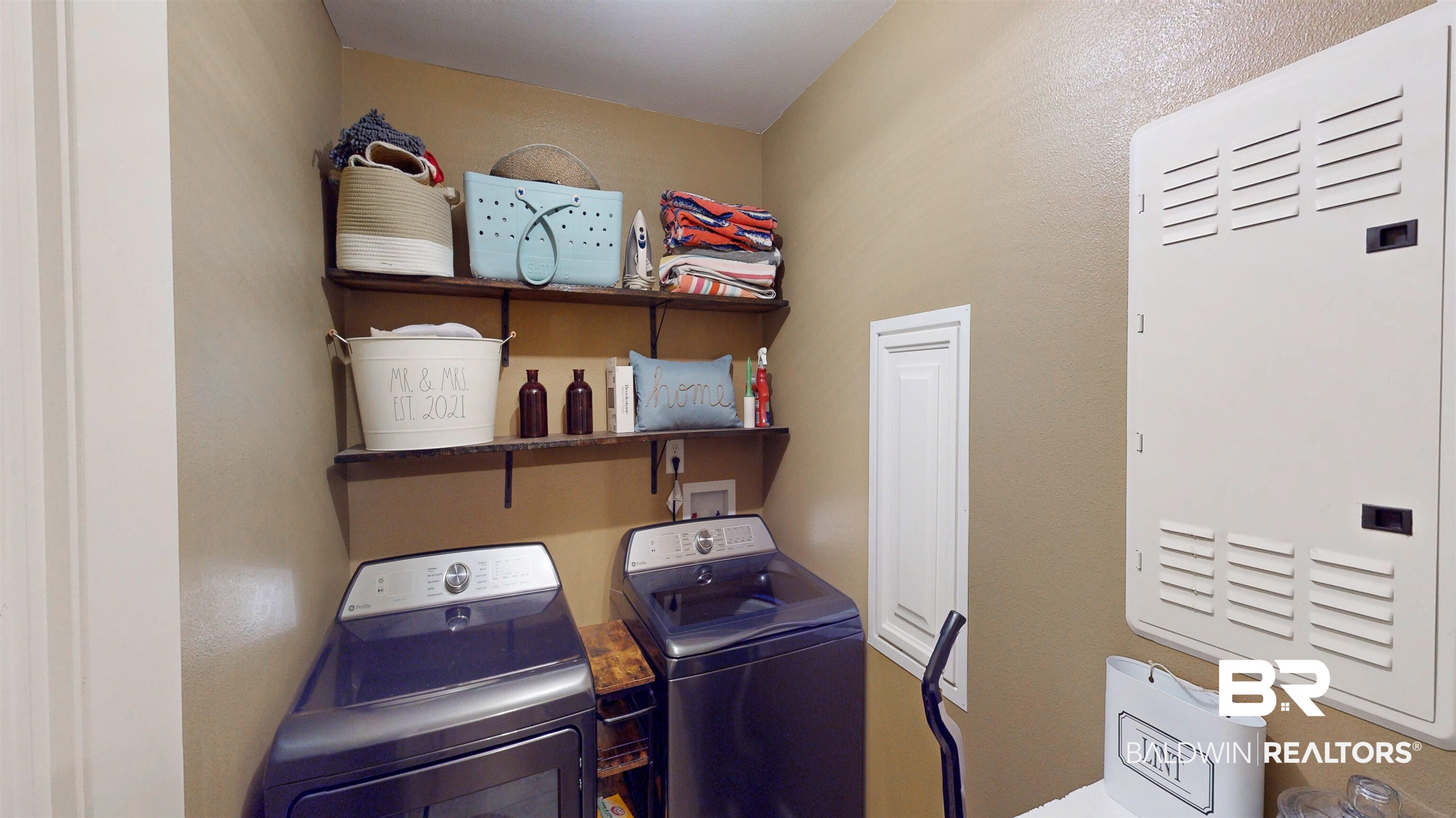 1304 Majesty Loop Foley, AL 36535 - Photo 21 of 44 Laundry area featuring a textured wall, a heating unit, and independent washer and dryer