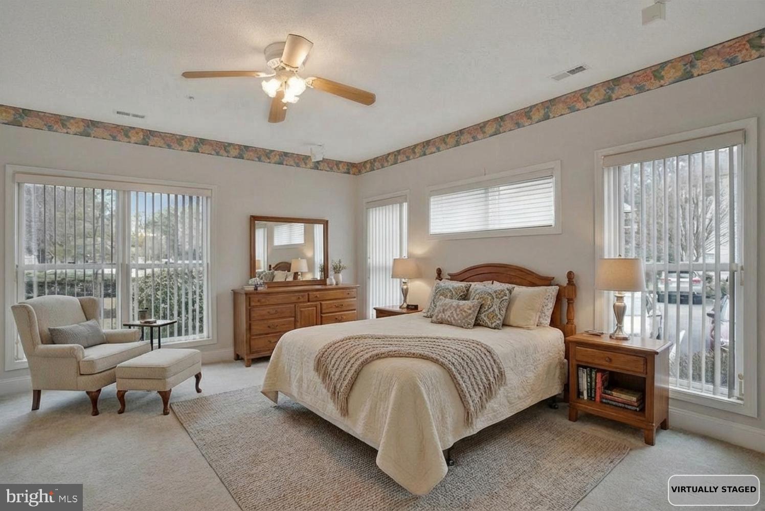 501 Runabout Loop, Unit 501 Solomons, MD 20688 - Photo 2 of 36 a bedroom with a bed and a couch